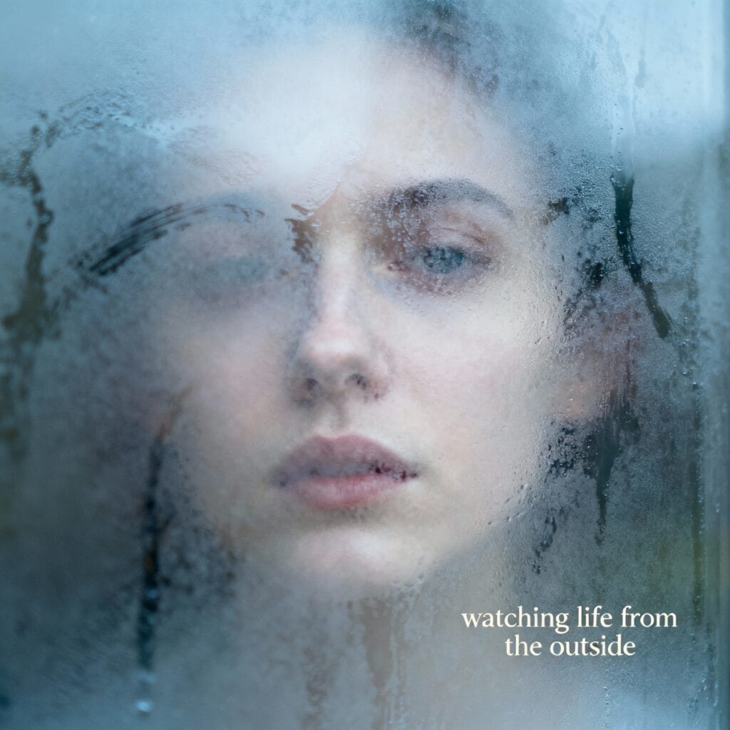 A faint reflection of a person’s face seen through a foggy window, symbolizing emotional detachment and blurred self-perception often experienced in depression.